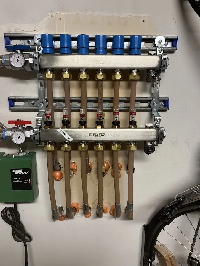 Plumber performing Water Heater Repair at a residential property in Summit View